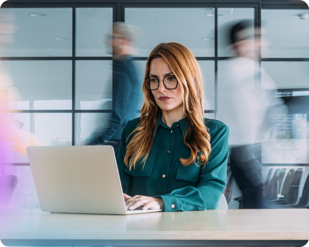 Woman looking worried at a laptop screen