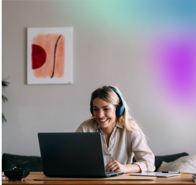 Woman smiling and looking at a laptop