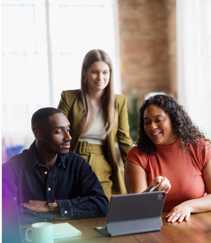 Product professional smiling at his desk while working through AI-empowered product discovery research