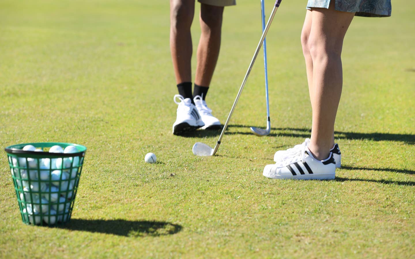 Two golfers putting at Holiday Hills Resort in Branson, Missouri.