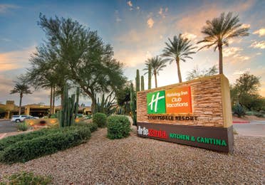 Holiday Inn Club Vacations Scottsdale Resort entrance sign with desert landscaping.