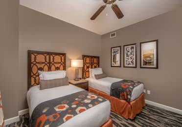 Bedroom with two twin beds in a three-bedroom villa at Sunset Cove Resort in Marco Island, Florida