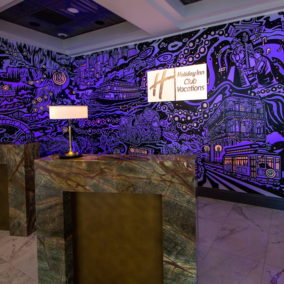 A mural with animated projection mapping in various colors of purple, orange, yellow and magenta featured in the lobby of our resort in New Orleans, Louisiana.