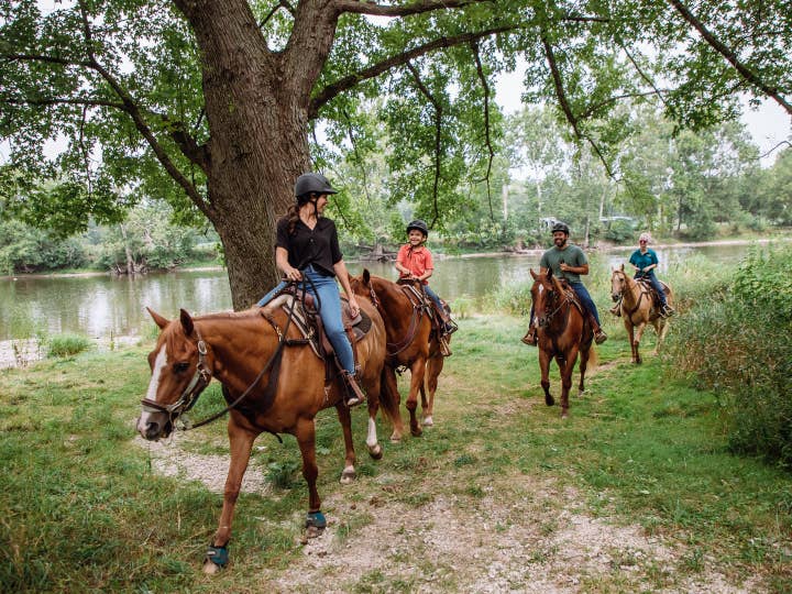 Guests riding horses at Fox River Resort in Sheridan, Illinois.
