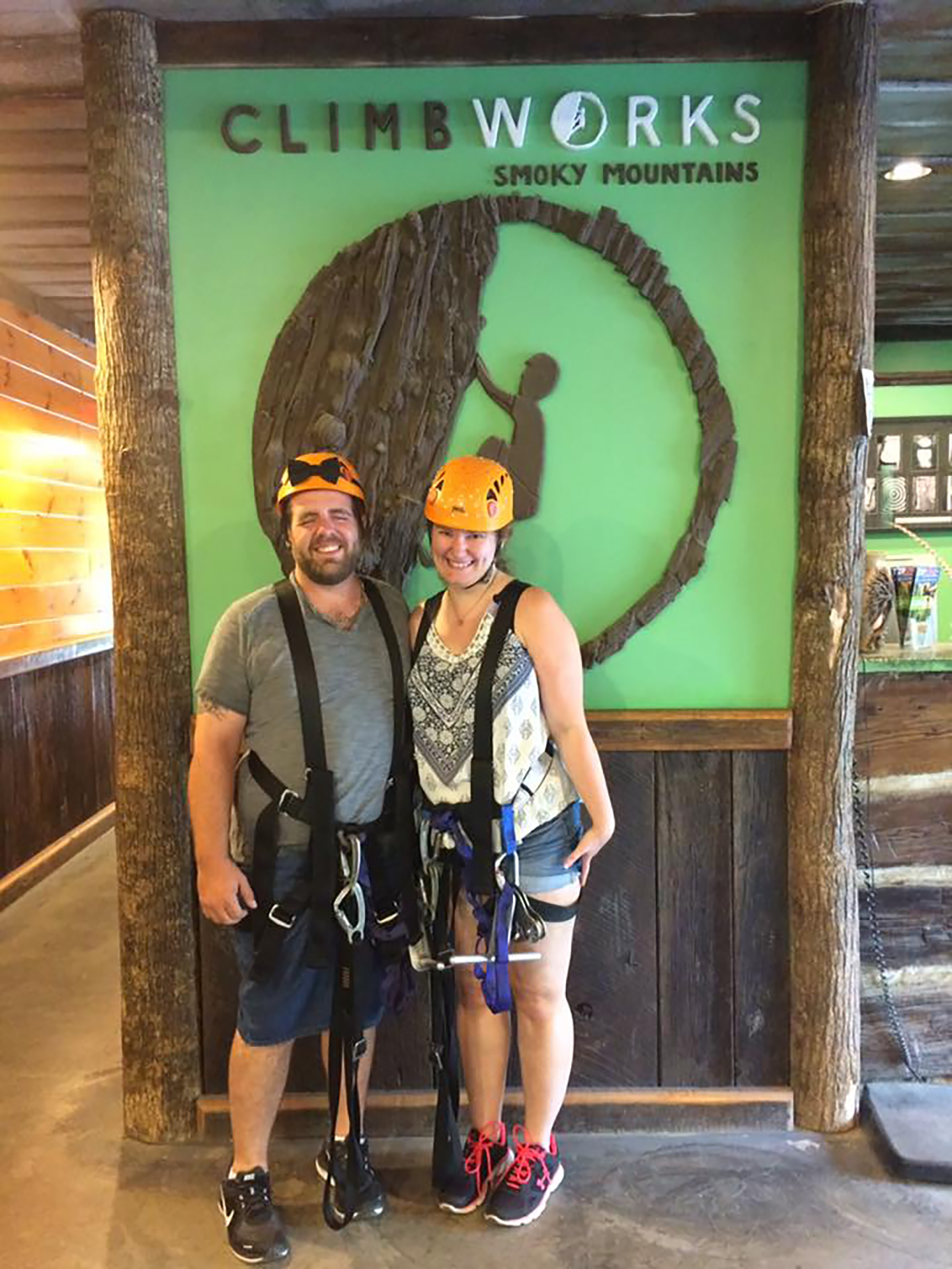 Becca and her husband wearing ziplining gear