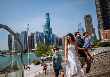 Family of four walking around the Navy Pier at Chicago, Illinois