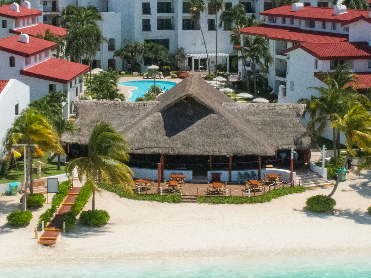 Outdoor pool bar beside the ocean at The Royal Cancun in Cancun, Mexico.