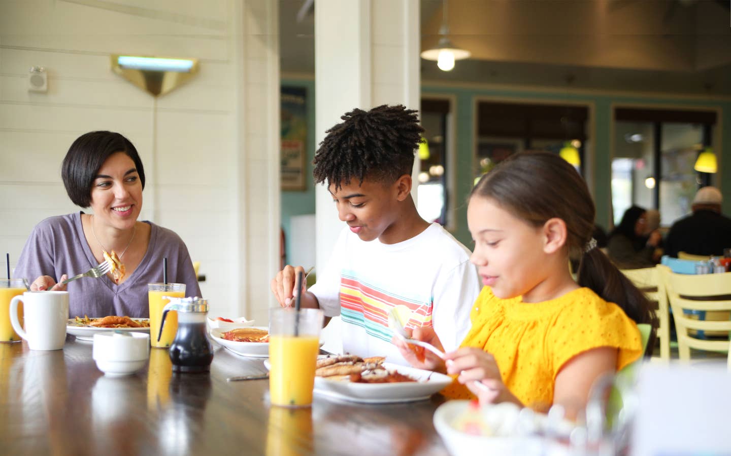 Family eating breakfast at Orange Lake Resort near Orlando, Florida.