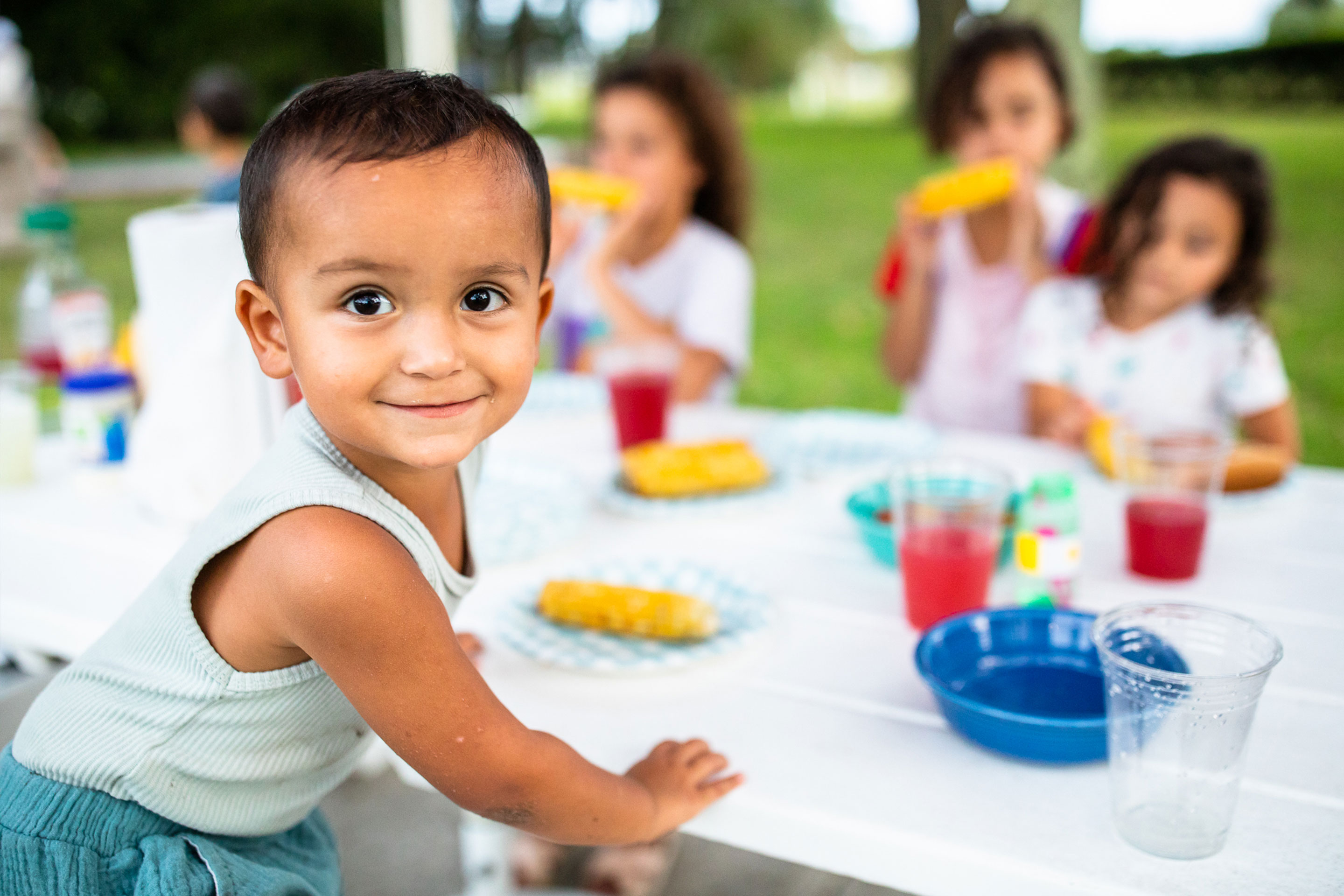 Author, Brenda Rivera Stearns' son (left) enjoys a meal with his sisters.