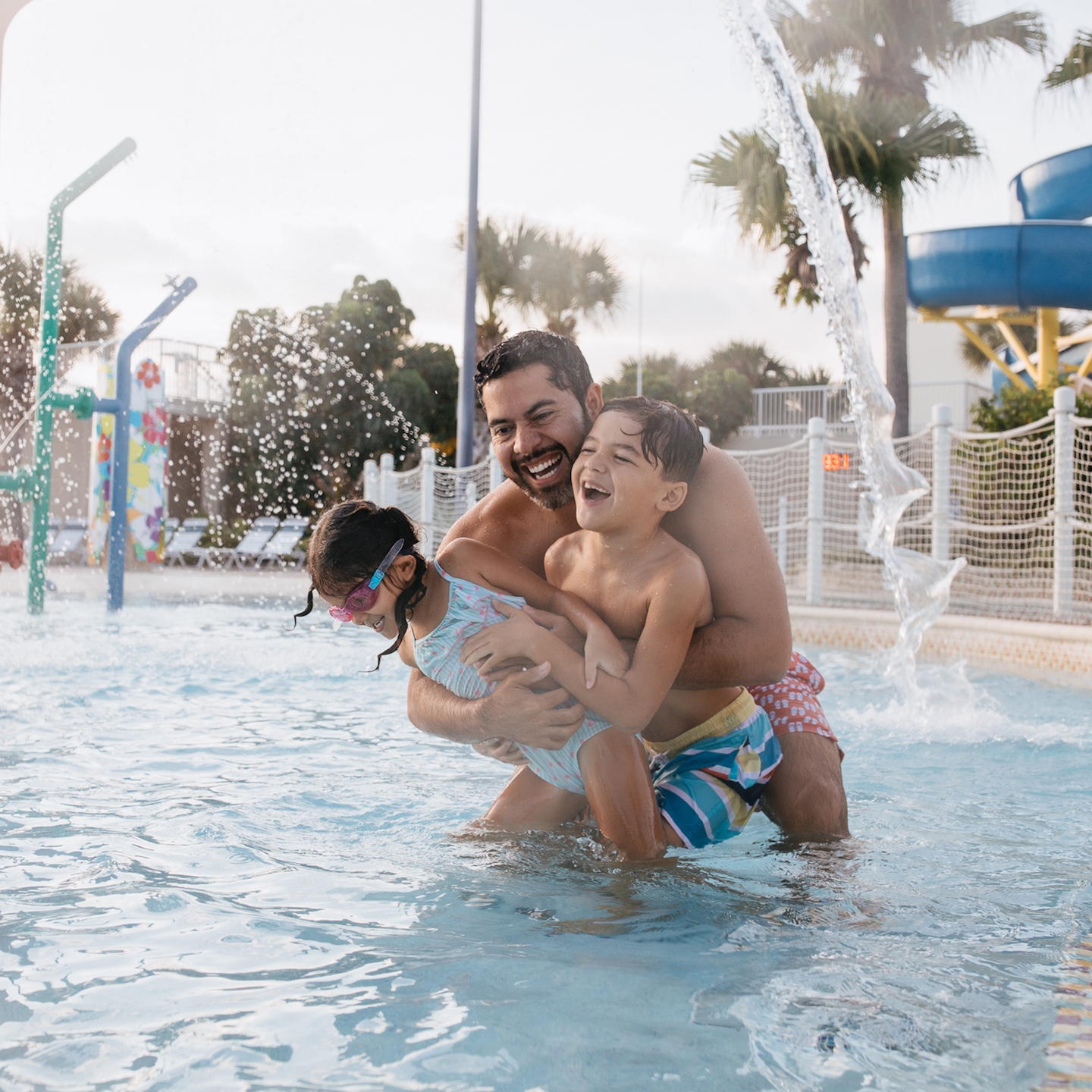 Family in pool at Cape Canaveral Beach Resort in Florida.