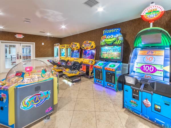 Game room with arcade-style games at Orlando Breeze Resort near Orlando, Florida.
