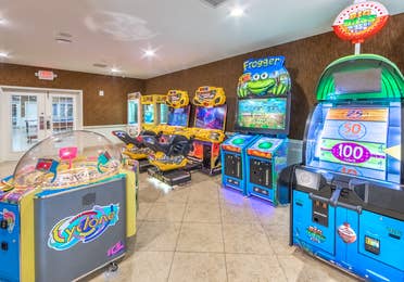 Game room with arcade-style games at Orlando Breeze Resort near Orlando, Florida.