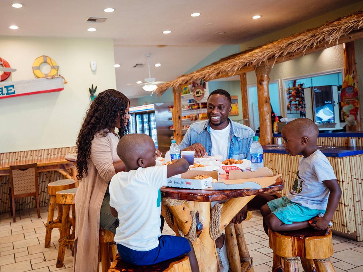family of four sitting at a table