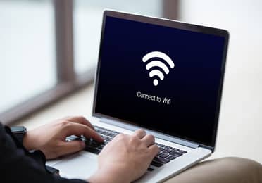 Laptop displaying a Wi-Fi connection screen, representing complimentary Wi-Fi at Banneker in Washington, D.C.