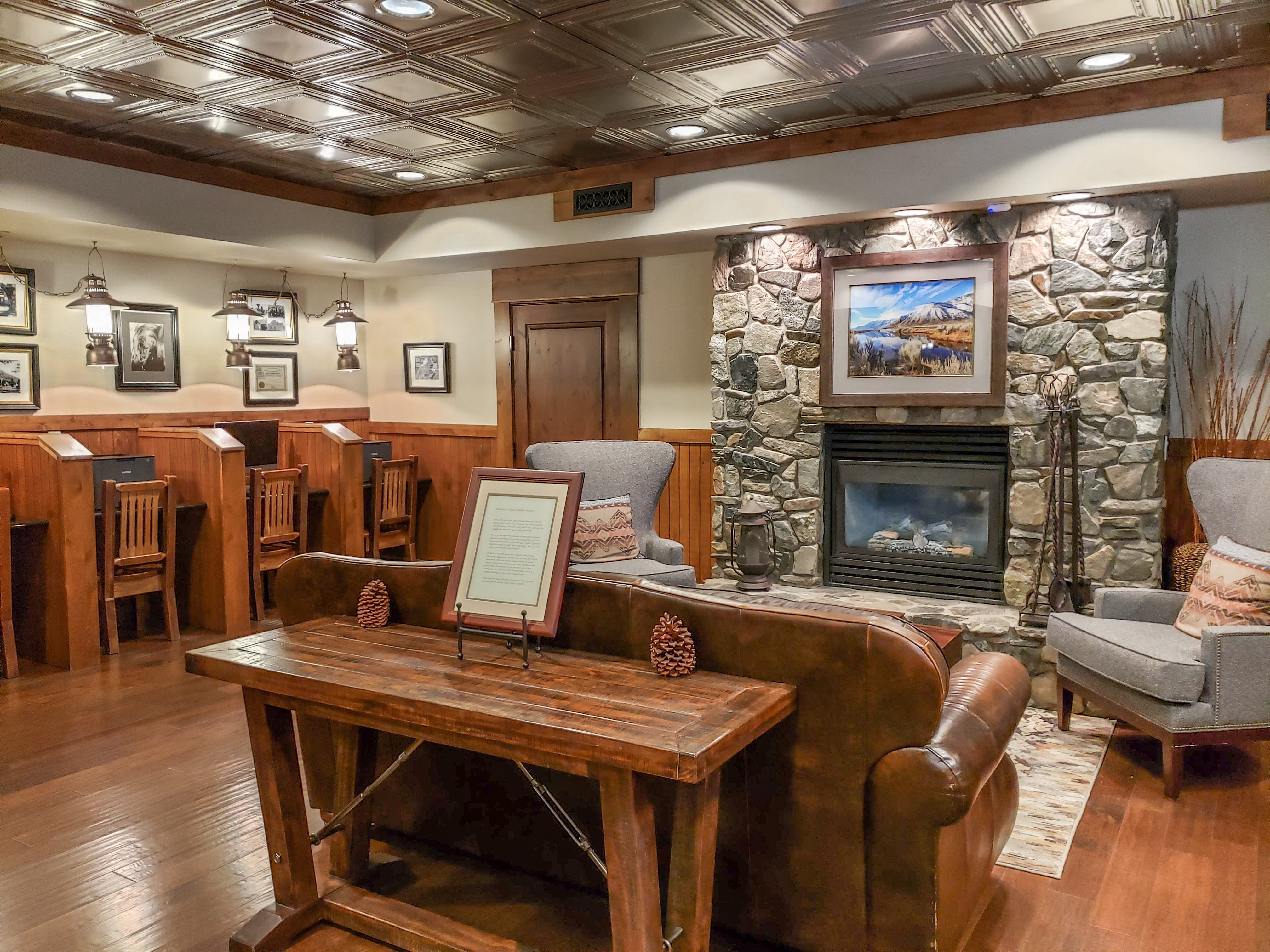 Lobby with stone fireplace and individual computers for guests to use at David Walley's Resort in Genoa, Nevada
