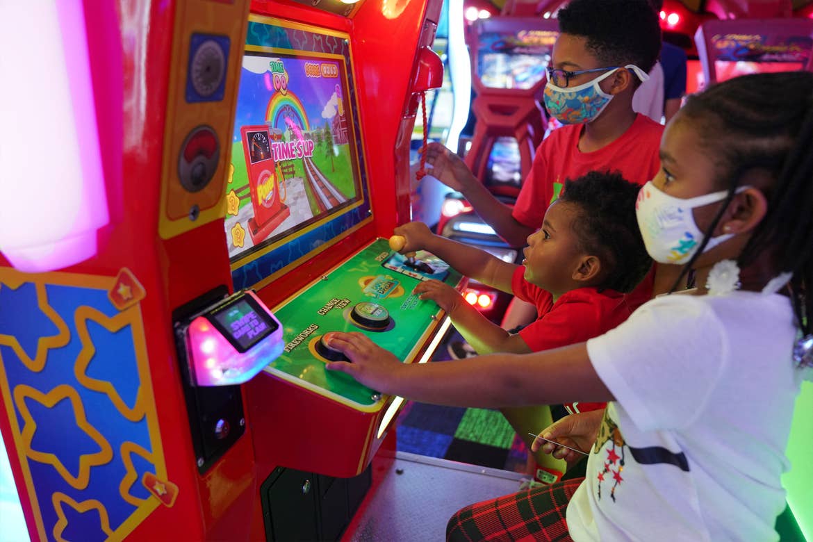 Featured Contributor, Tina Meeks' children play in the arcade of our Orange Lake resort in Orlando, Florida.