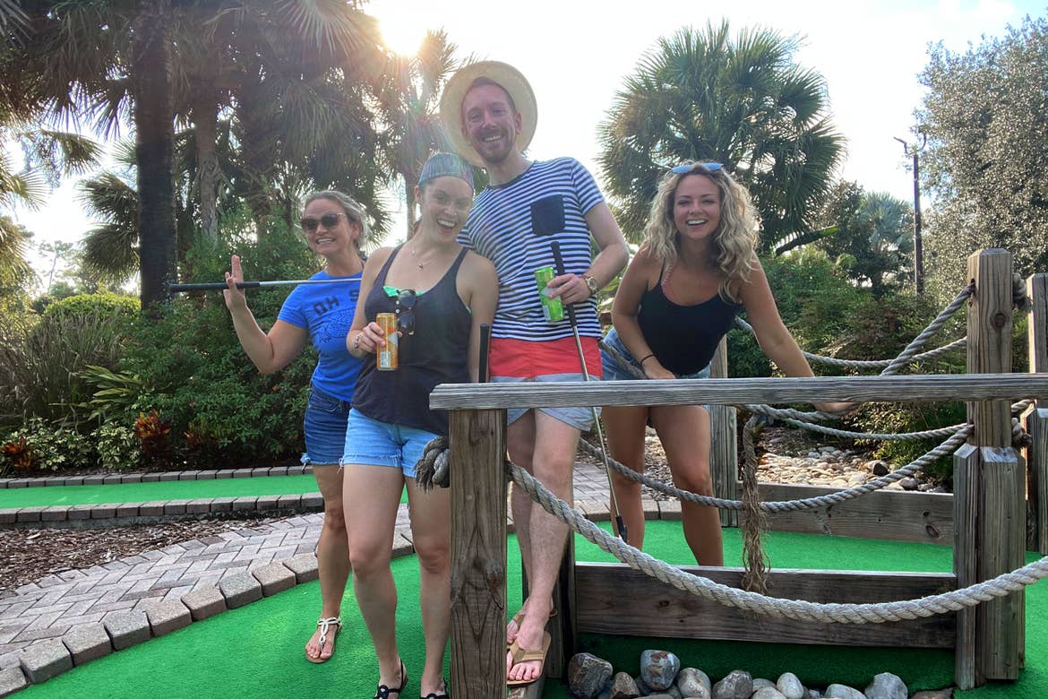 Featured Contributor, Angie Orth (far-right), and her friends hold their putters outside on our mini-golf course.