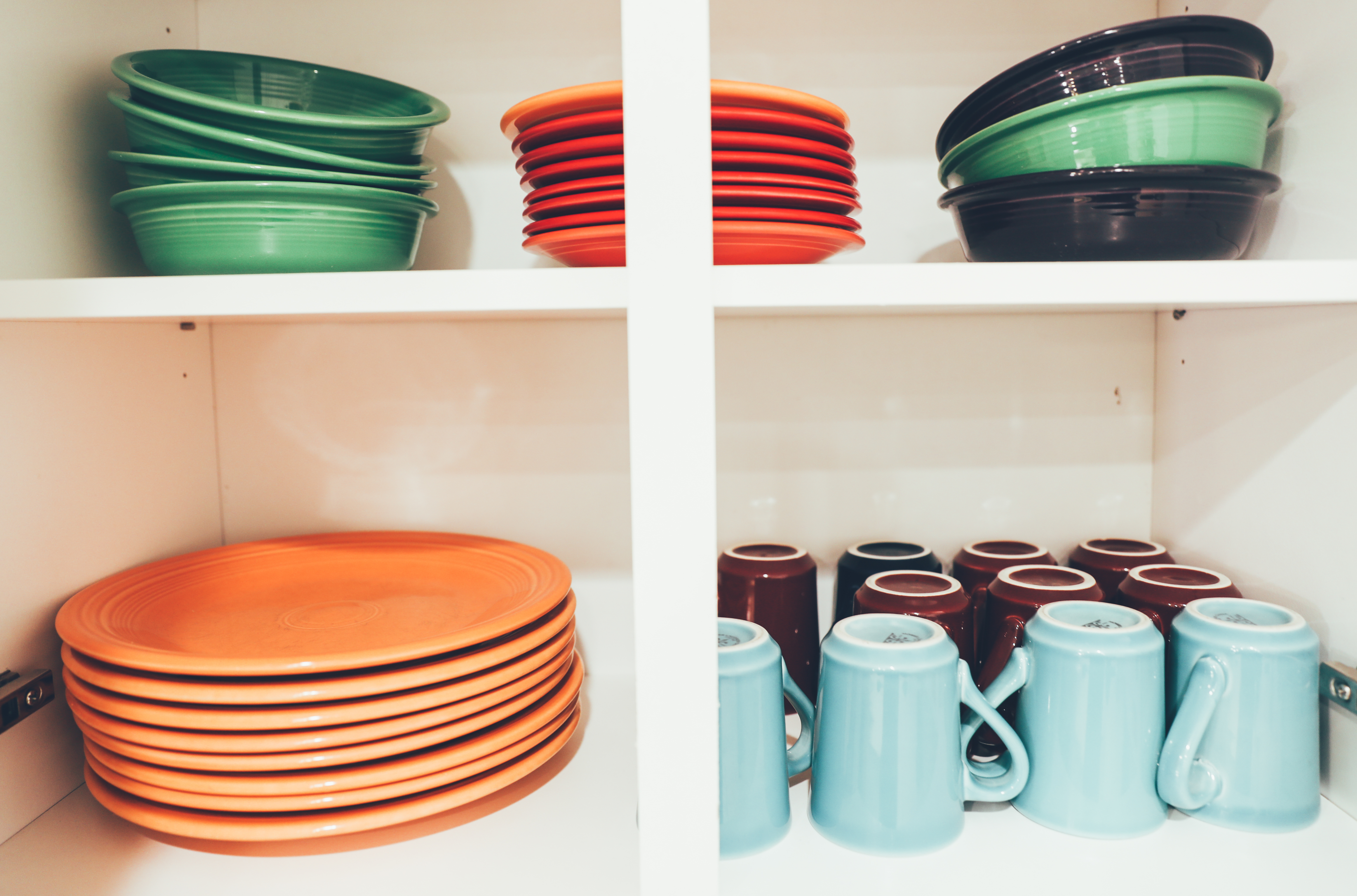 Colorful dishes in cabinet in a villa in River Island at Orange Lake Resort near Orlando, Florida