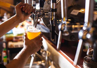 Image of a person pouring tap beer near Lake Geneva Resort, Lake Geneva, WI.