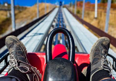 Person riding the mountain coaster at Gatlinburg Mountain Coaster near Smoky Mountain Resort in Gatlinburg, TN