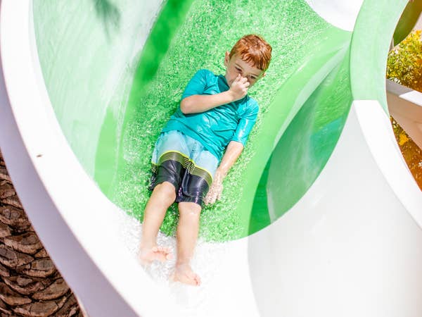 Child going down waterslide at Scottsdale Resort in Arizona.