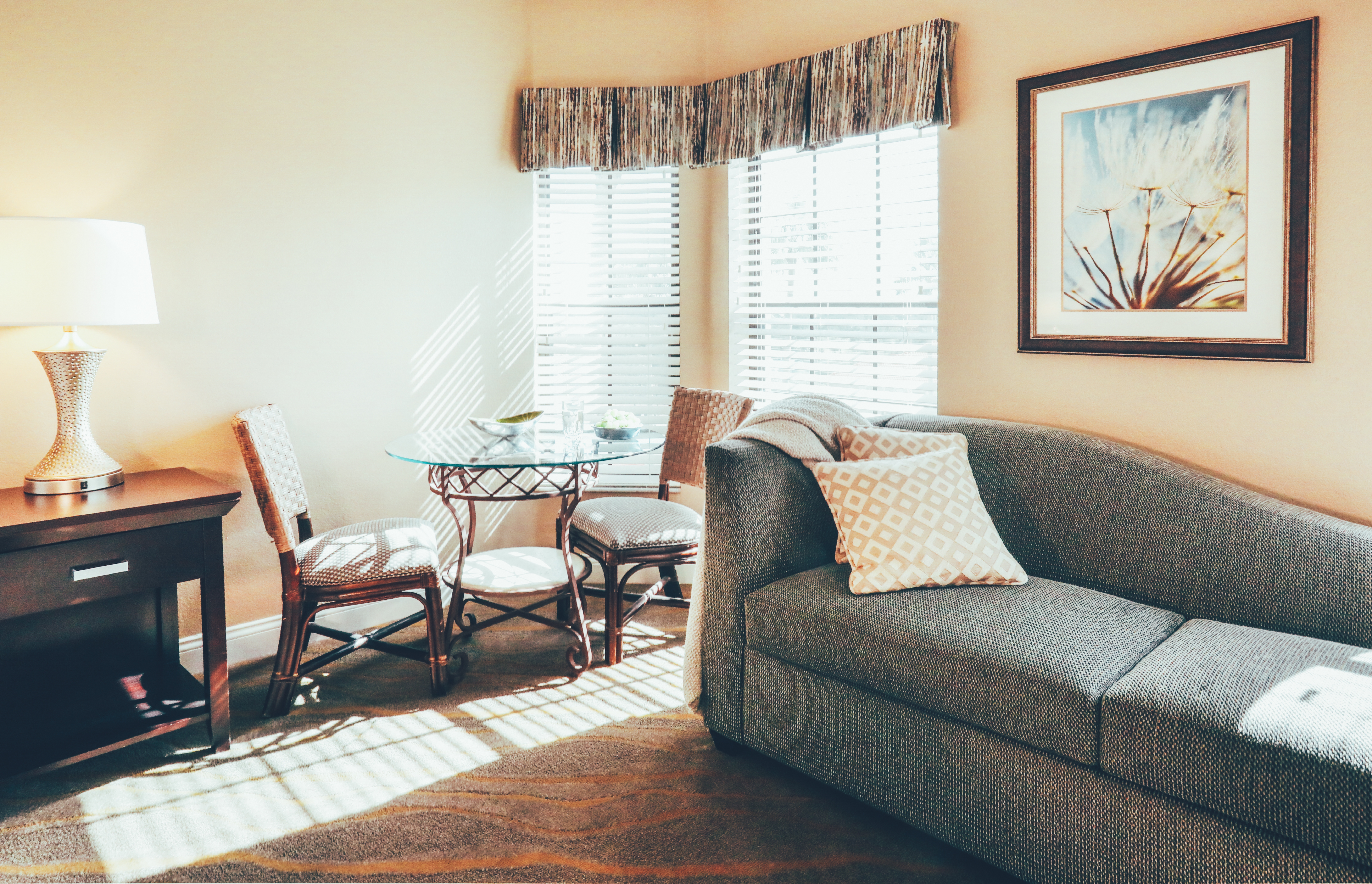 Couch and small dining area in a three bedroom villa in West Village at Orange Lake Resort near Orlando, FL