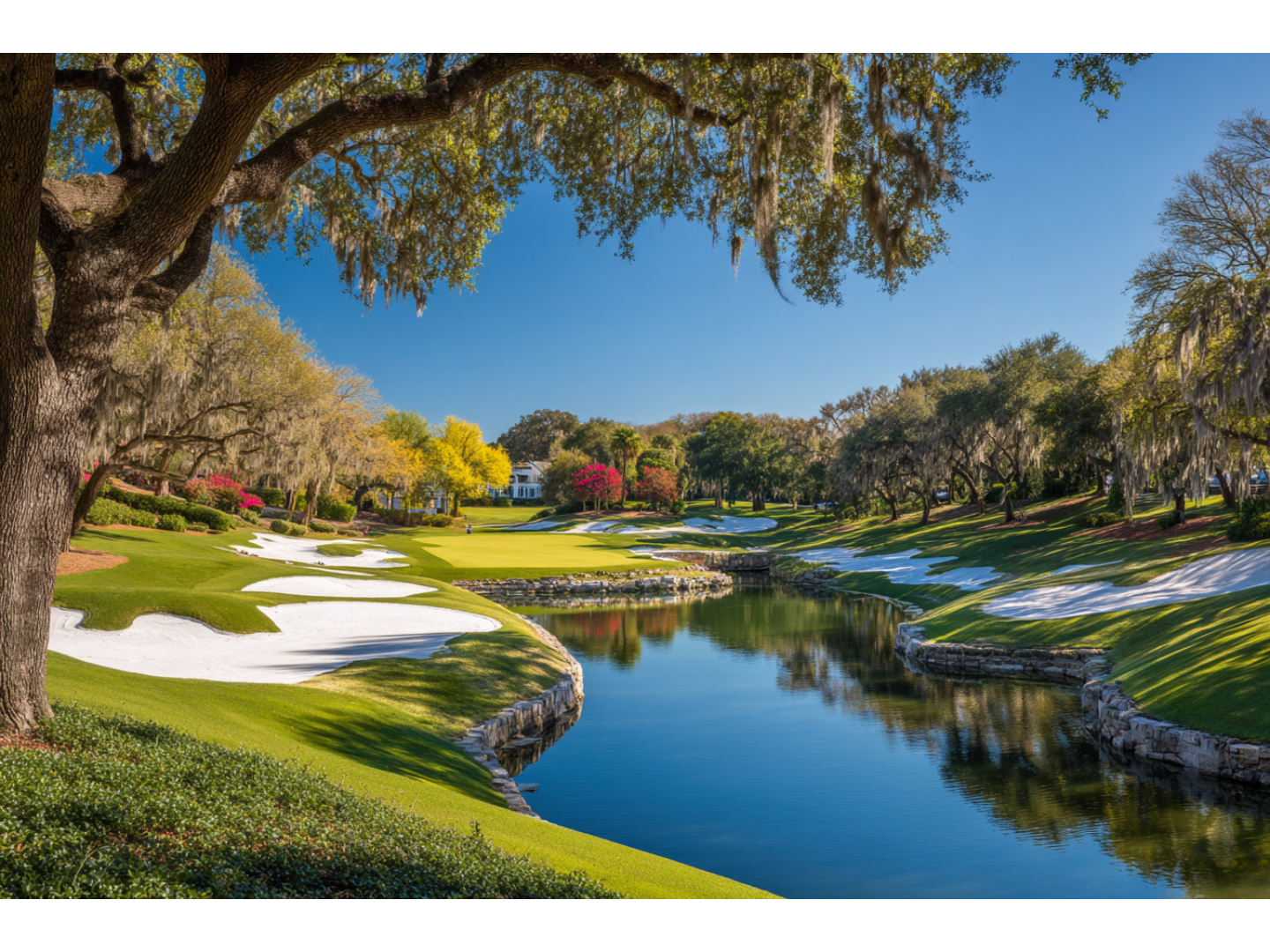 Green golf course with stone river running through the middle.