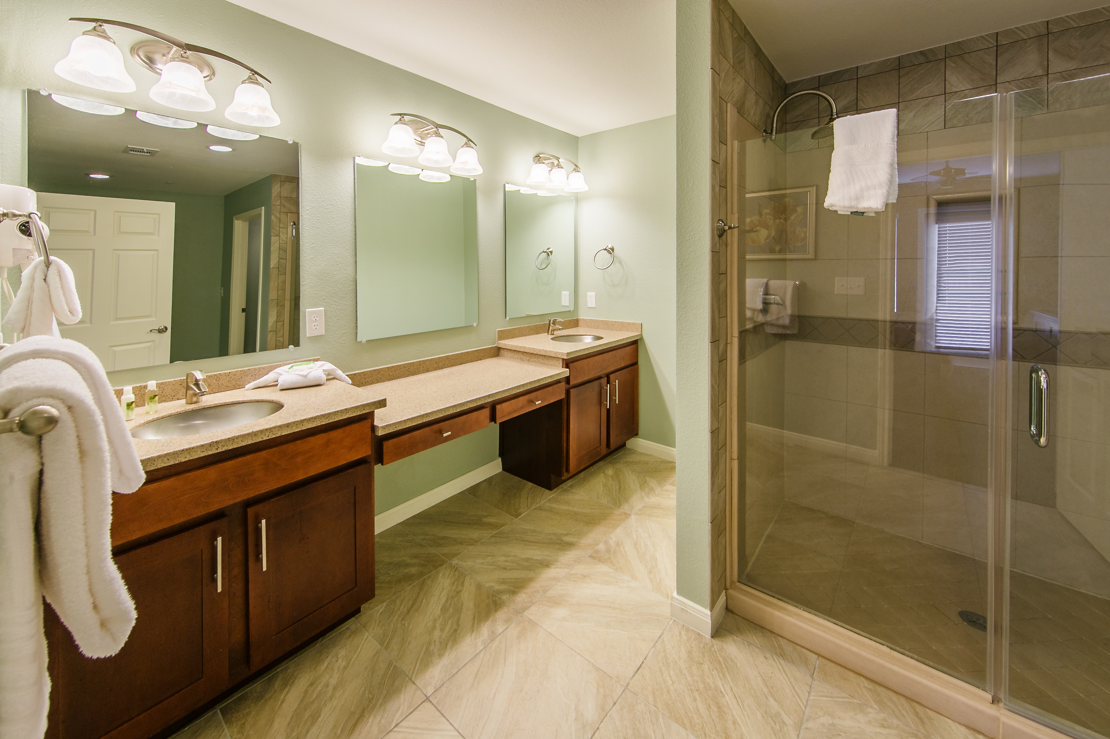 Master Bathroom with double sinks and a large shower in a two-bedroom ambassador villa at the Hill Country Resort in Canyon Lake, Texas.