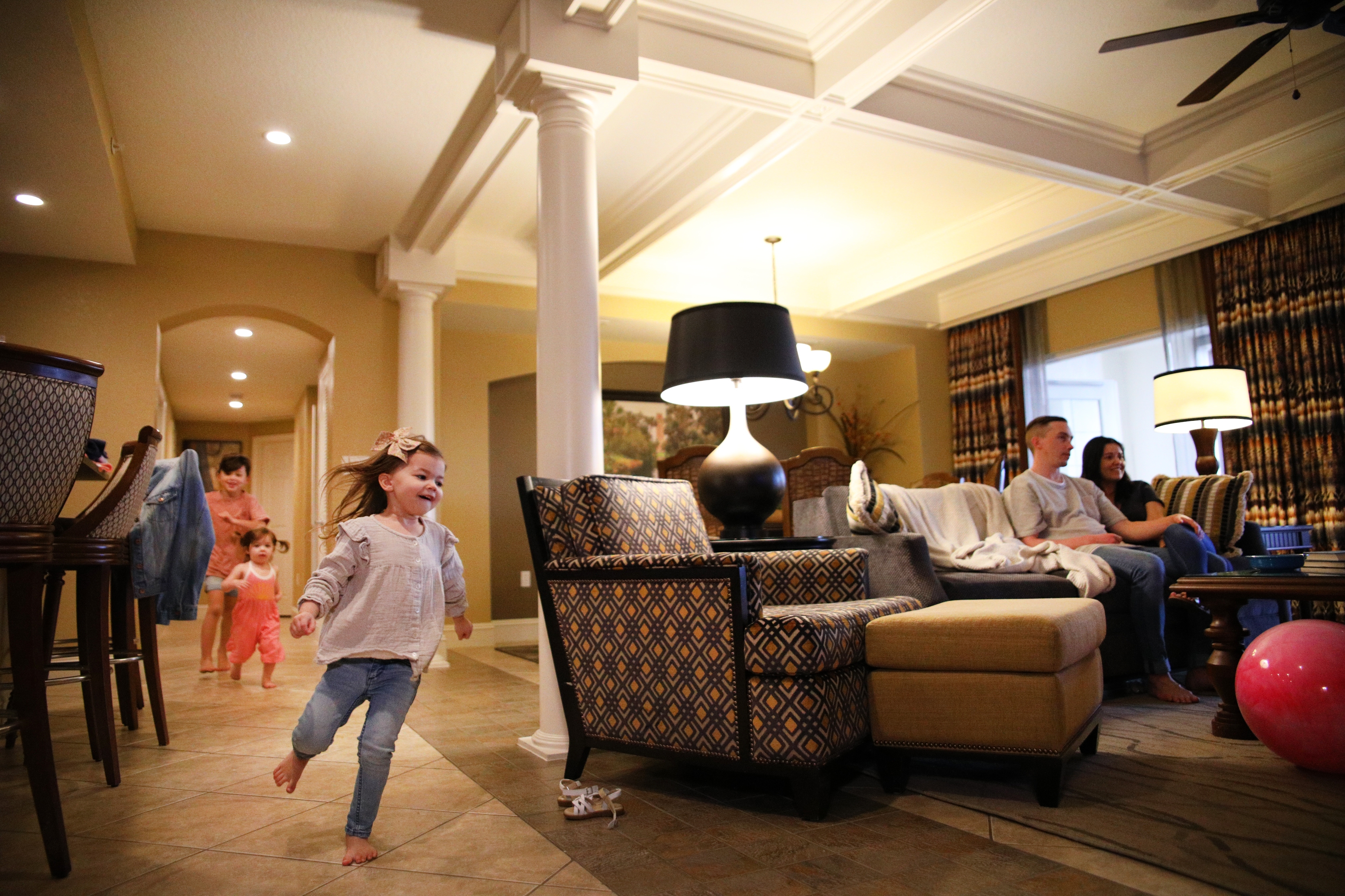 Mia St Clair's kids running around in their villa at Orange Lake Resort