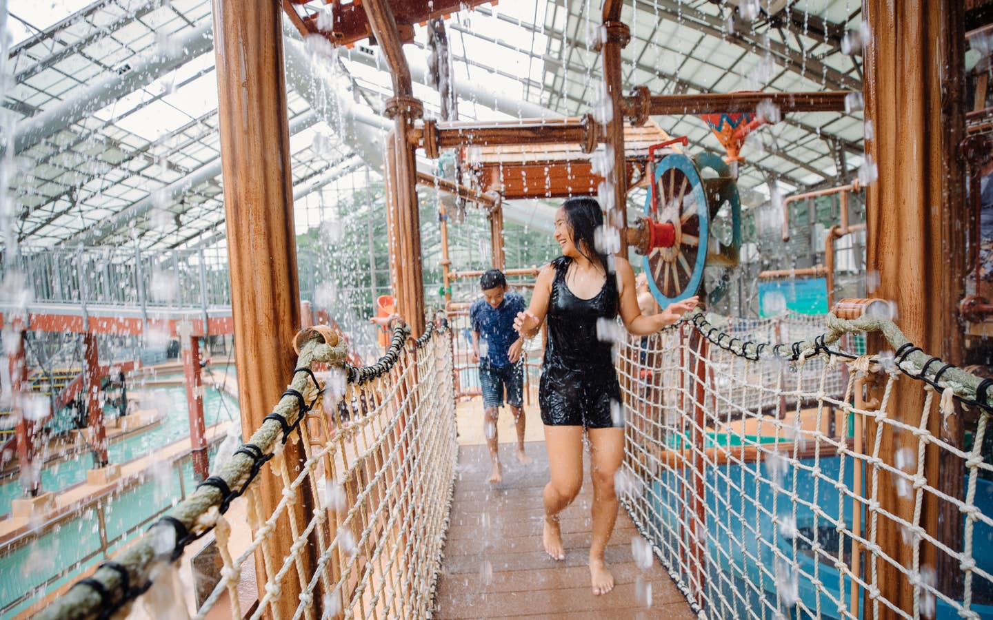 Two kids walking through waterpark at Villages Resort in Flint, Texas.