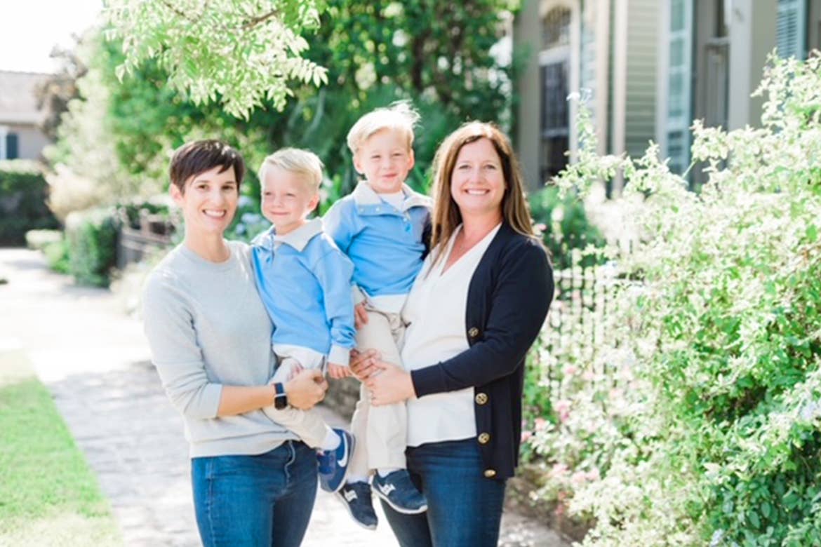 Featured Contributor, Catherine Karas (left), and her family stand outdoors.