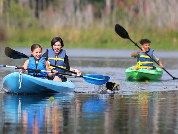 Three guests kayaking.