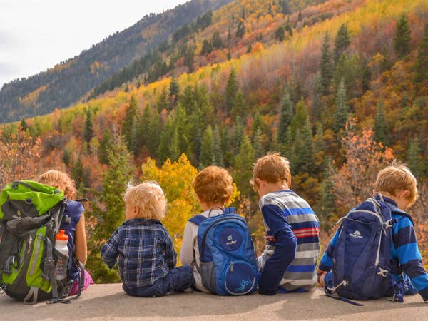 Jessica's kids sitting in front of fall foliage in the Smoky Mountains