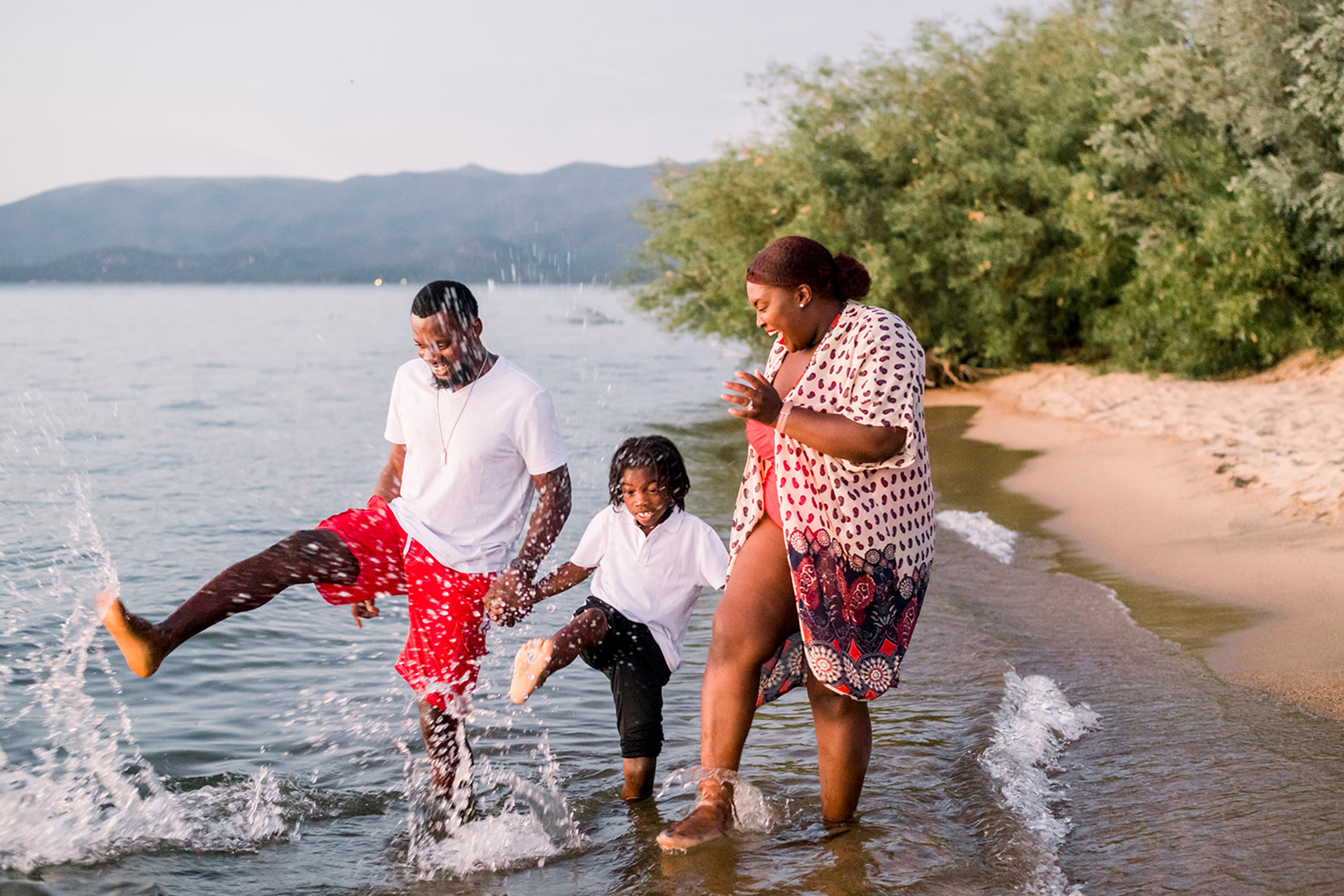 Karen and her family splashing in the water at Tahoe Keys Beach