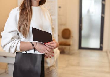 Woman with gift at the Grand Residences Resort in Puerto Morelos, Mexico