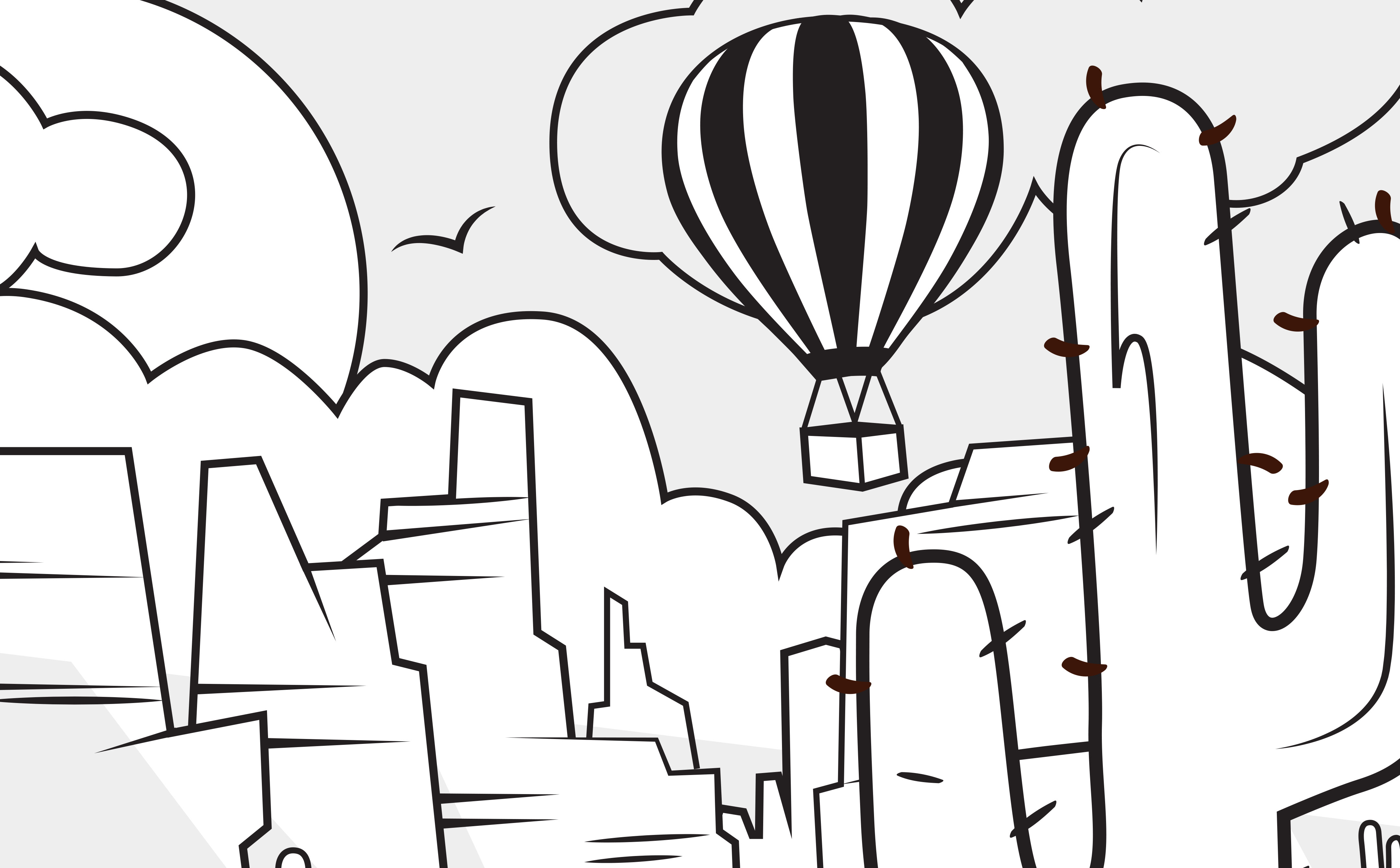 A coloring sheet featuring a hot air balloon in the desert