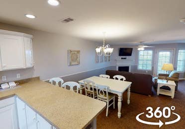Dining area and living room in a two-bedroom Presidential villa at Galveston Seaside Resort in Galveston, Texas.