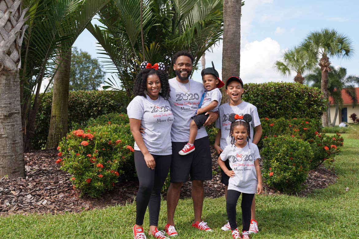 Featured Contributor, Tina Meeks, stands with her husband, daughter and sons in matching Disney shirts and accessories at our Orange Lake resort in Orlando, Florida.