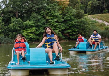 Family paddle boating at Fox River Resort in Sheridan, Illinois.