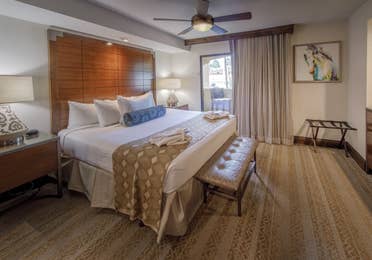 Bedroom with king bed and attached balcony in a signature one-bedroom villa at Scottsdale Resort