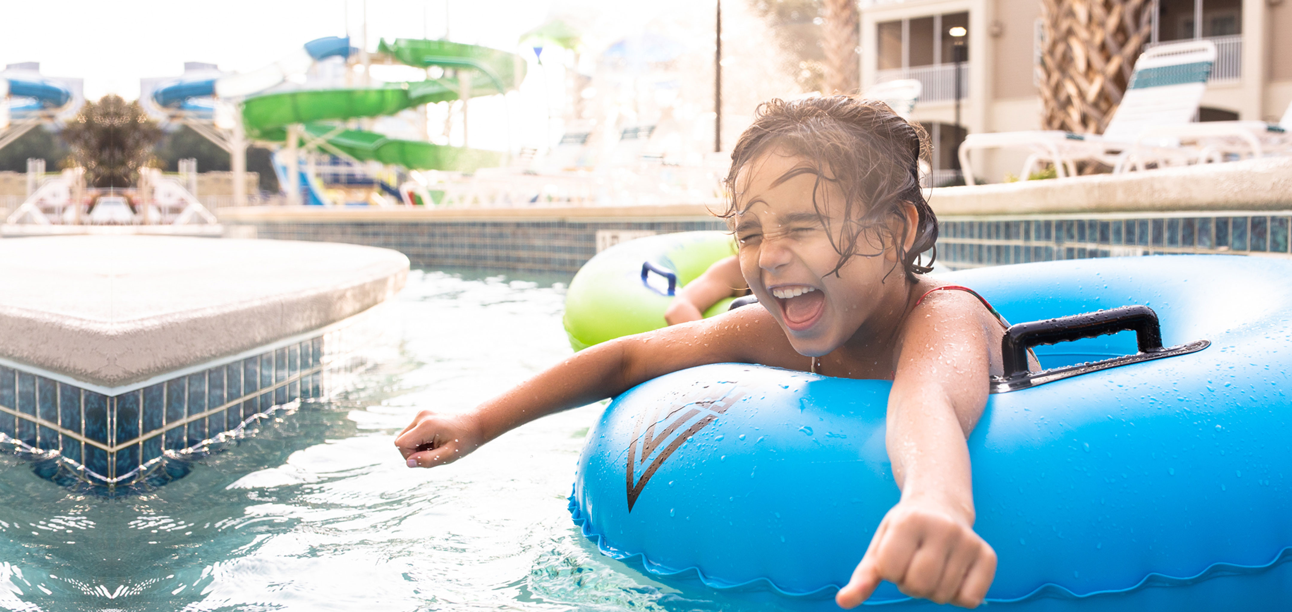 Author, Brenda Rivera Stearns' daughter, Victoria, floating along the lazy river in a blue innertube at our South Beach resort in Myrtle BEach, South Carolina.