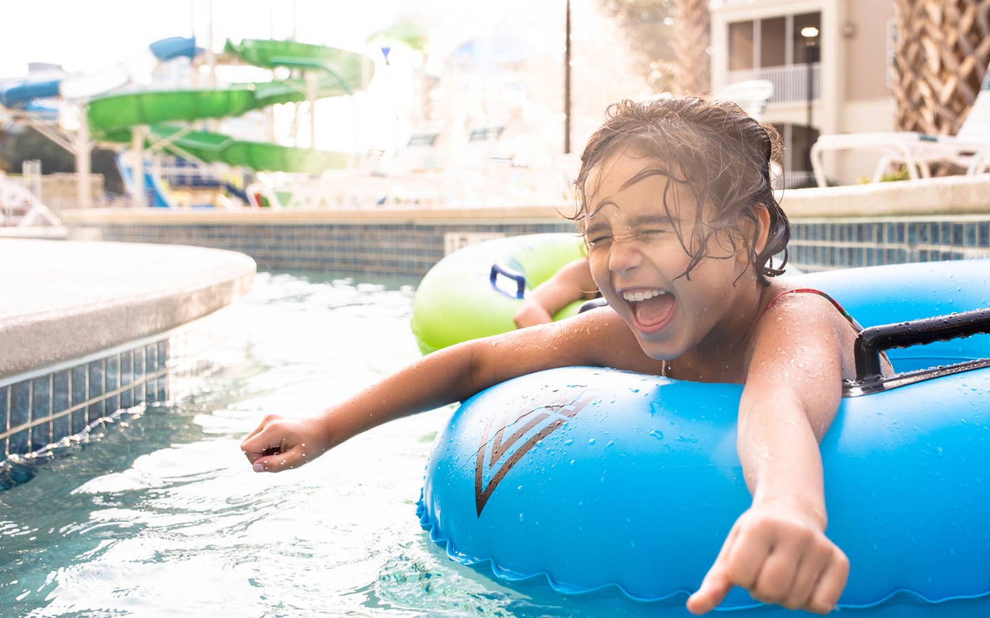 Author, Brenda Rivera Stearns' daughter, Victoria, floating along the lazy river in a blue innertube at our South Beach resort in Myrtle BEach, South Carolina.