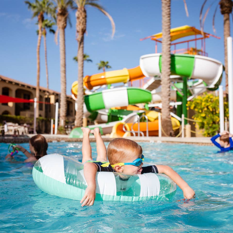 Young child floating in pool at Scottsdale Resort.