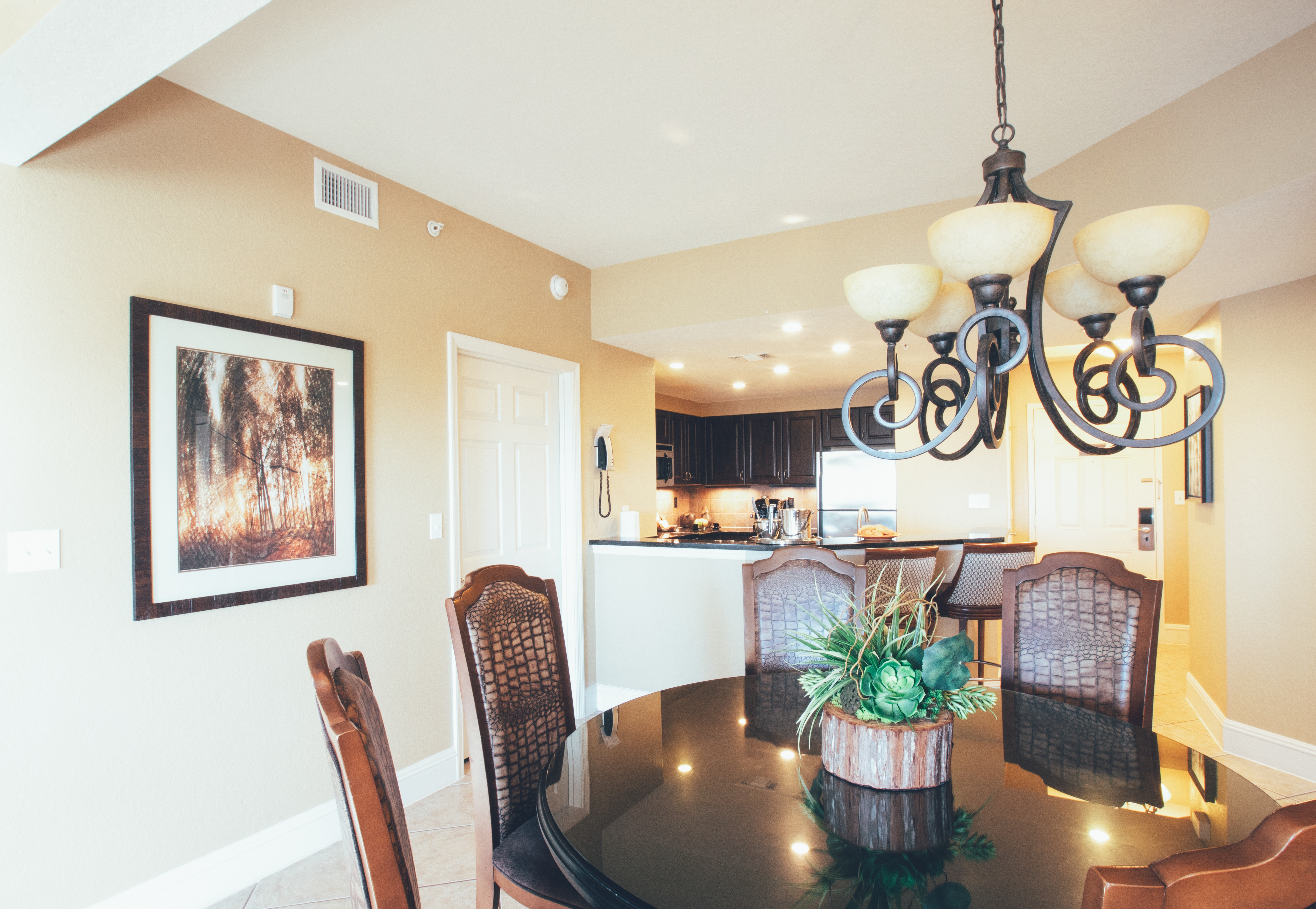Dining room table with five chairs in a Signature villa in River Island at Orange Lake Resort near Orlando, Florida