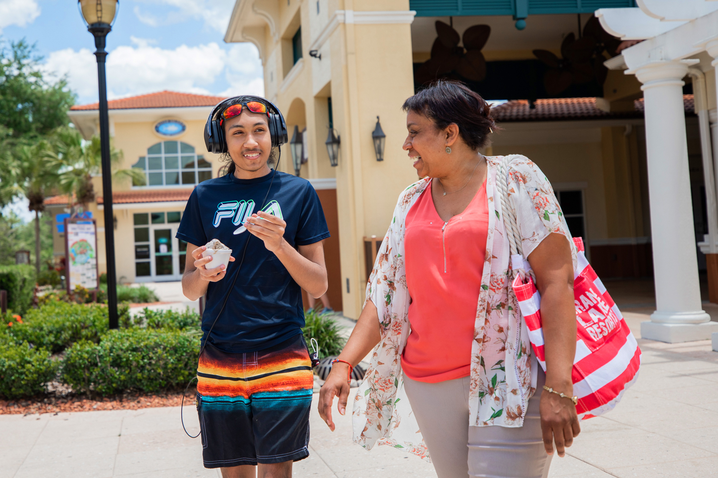 Special Olympic Athlete, Roan Luallen (left), and his mother, Sherryll Luallen (right), enjoy a cool treat outside of our Orange Lake Resort located in Orlando, Florida.