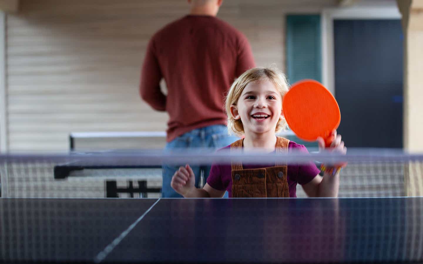 Child playing ping pong at David Walley's Resort in Genoa, Nevada.