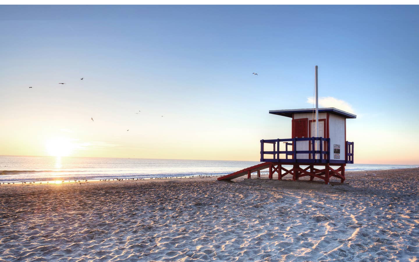 Cape Canaveral Beach with Lifeguard hut at sunset.