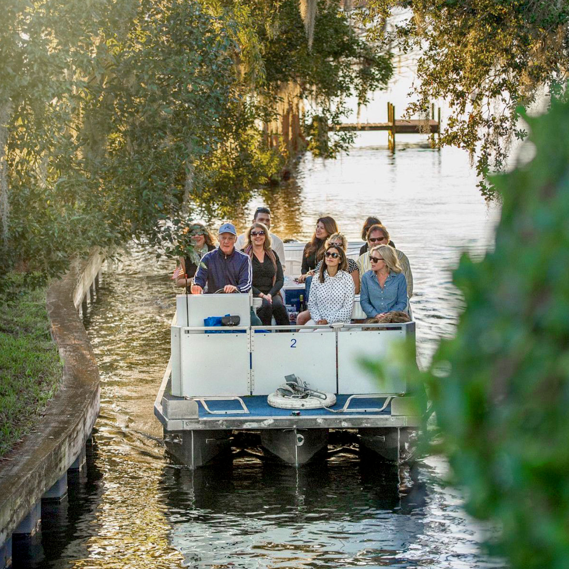 A tour guide speaks with the guests on board as they float through a canal. Photo courtesy of Visit Orlando
