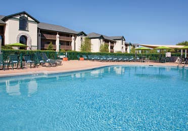 Outdoor pool with sun chairs at Lake Geneva Resort in Wisconsin.
