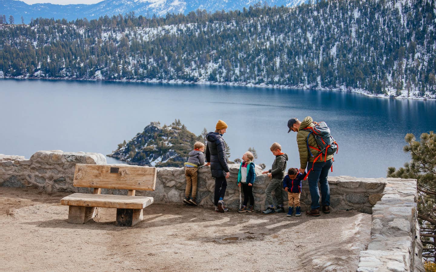 Andrea Rassmussen's family stands overlooking Emerald Bay State Park with a gorgeous forest, mountains and lake as a backdrop.